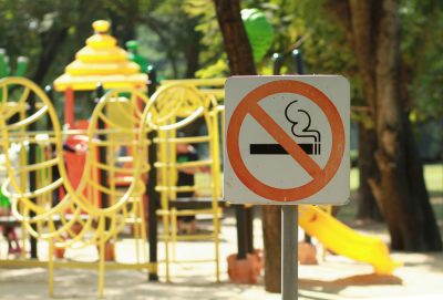No,Smoking,Sign,Near,Children's,Playground,In,Public,Park