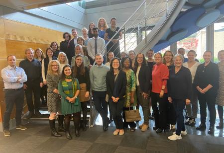 Group photo from workshop Law and Tobacco Control: Global and European perspectives. About 30 people are posing for a photo by a staircase