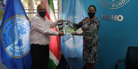 Minister of Health, Antoine Elias, officially handed over the “National COVID-19 Preparedness and Response Plan” and “Comprehensive Needs Lists Preparedness and Response for COVID-19” to PAHO/WHO Suriname Representative Dr Karen Lewis-Bell on 25 June 2020.
