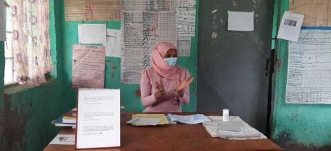 A health extension worker at her workstation.