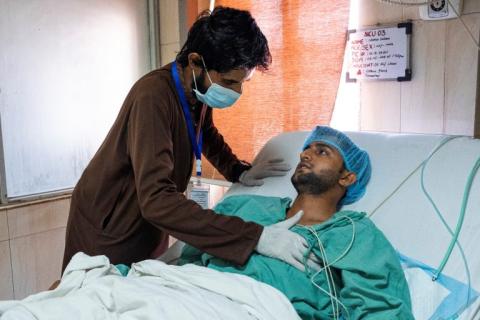 4 May 2019: Naman Saleem, 22, is assisted by a health worker during his chest post-operation physical rehabilitation at the Pakistan Institute of Medical Sciences in Islamabad.
