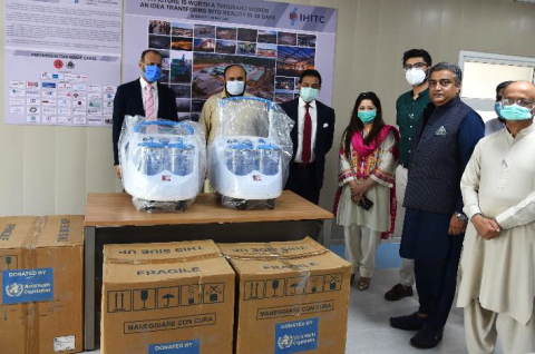 Dr Palitha Mahipala, WHO Representative in Pakistan (third from left), leads the ceremonial hand over of heavy duty suction machines to the Isolation Hospital and Infectious Treatment Center (IHITC) in Islamabad.